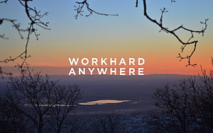 Work Hard Anywhere: Sunset Over Valley With Silhouetted Branches HD wallpaper