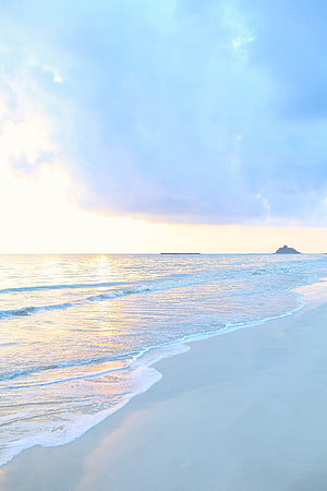 Serene Tropical Beach at Golden Hour with Gentle Waves and Distant Island HD phone wallpaper