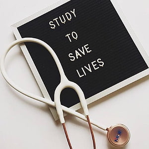 Stethoscope on Letter Board with Study to Save Lives Medical Motivation HD phone wallpaper