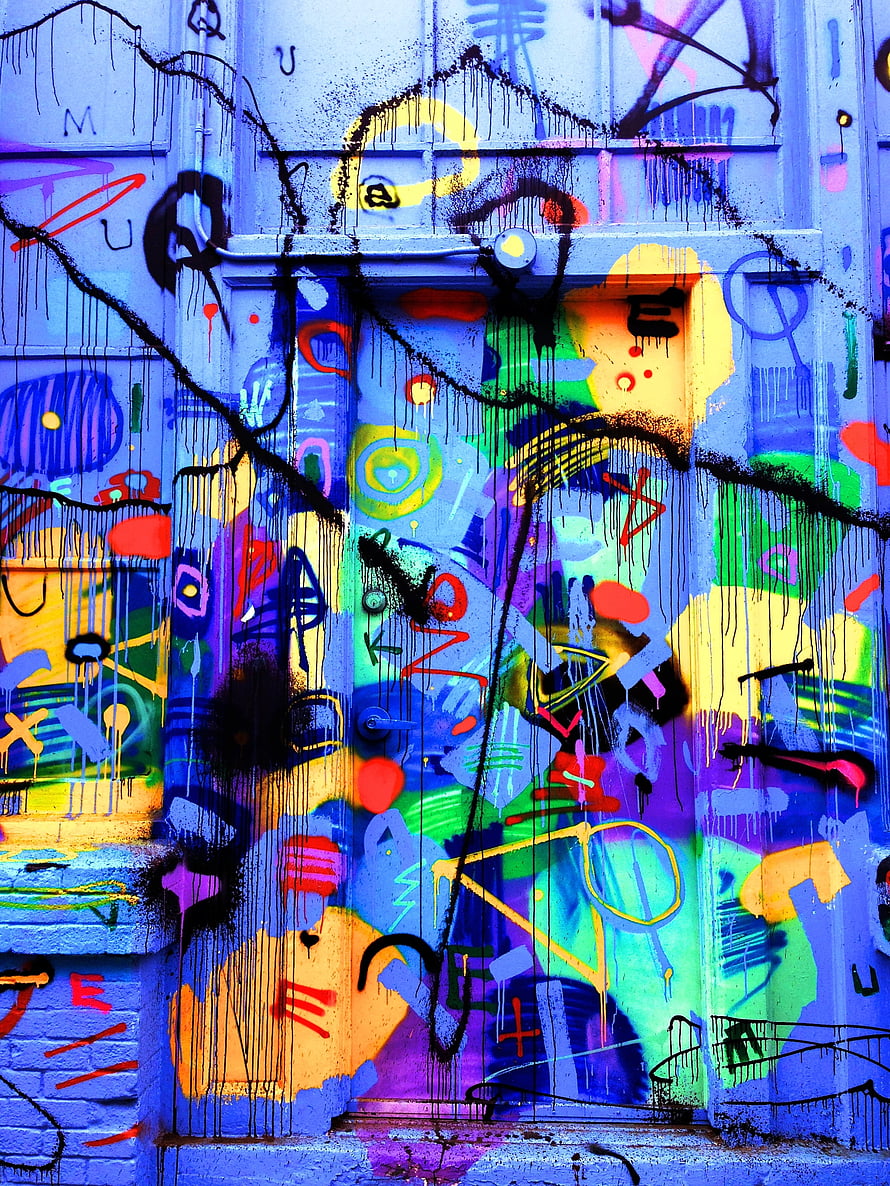 Vibrant Multicolored Graffiti Art Covering a Weathered Urban Door HD phone wallpaper