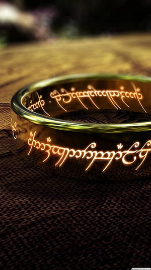 The One Ring from Lord of the Rings with Glowing Elvish Script on Dark Fabric HD phone wallpaper