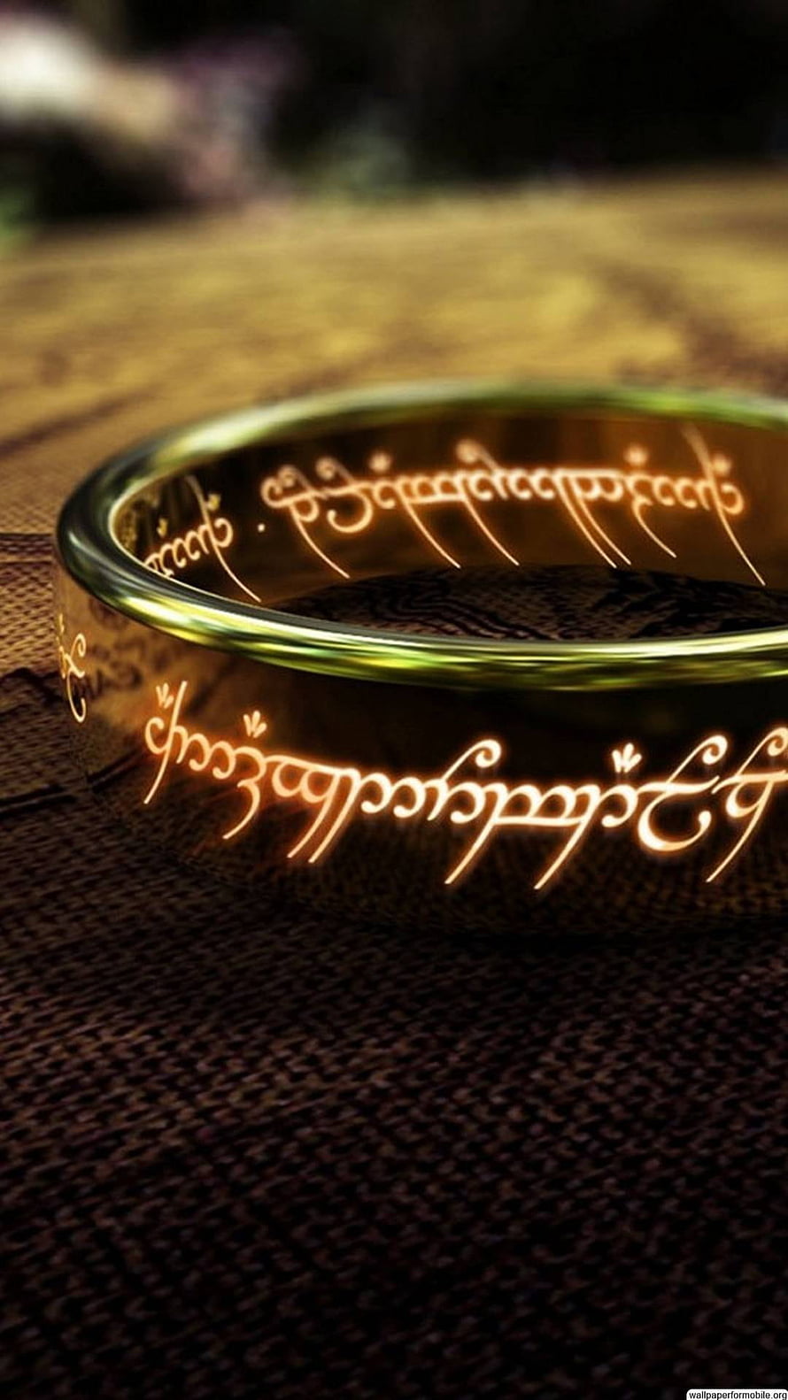 The One Ring from Lord of the Rings with Glowing Elvish Script on Dark Fabric HD phone wallpaper