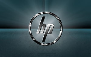 Sleek HP Logo on Textured Teal Surface with Metallic Ring and Soft Light Rays HD wallpaper