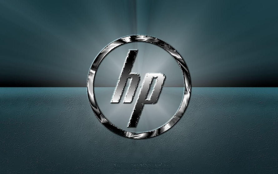 Sleek HP Logo on Textured Teal Surface with Metallic Ring and Soft Light Rays HD wallpaper
