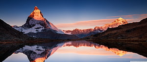 Matterhorn Mountain at Sunrise with Perfect Lake Reflection in the Swiss Alps HD wallpaper