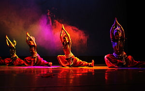 Indian Classical Dance Performance with Dramatic Stage Lighting and Smoke Effects HD wallpaper