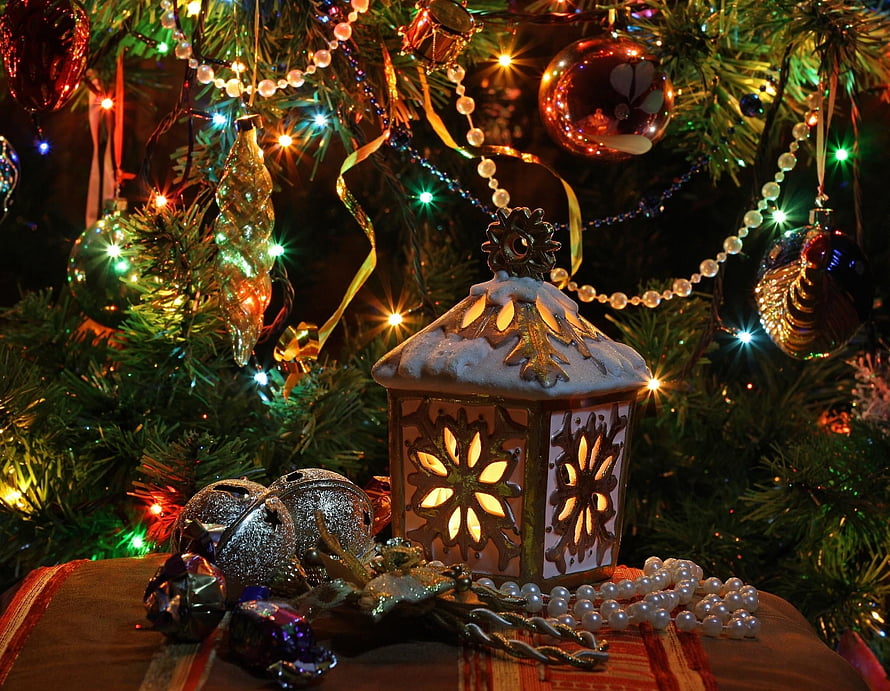 Festive Christmas Lantern with Snowflake Cutouts and Ornaments on a Decorated Tree HD wallpaper