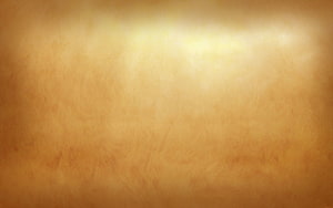 Warm Golden Leather Texture with Soft Central Light Glow and Subtle Surface Grain HD wallpaper