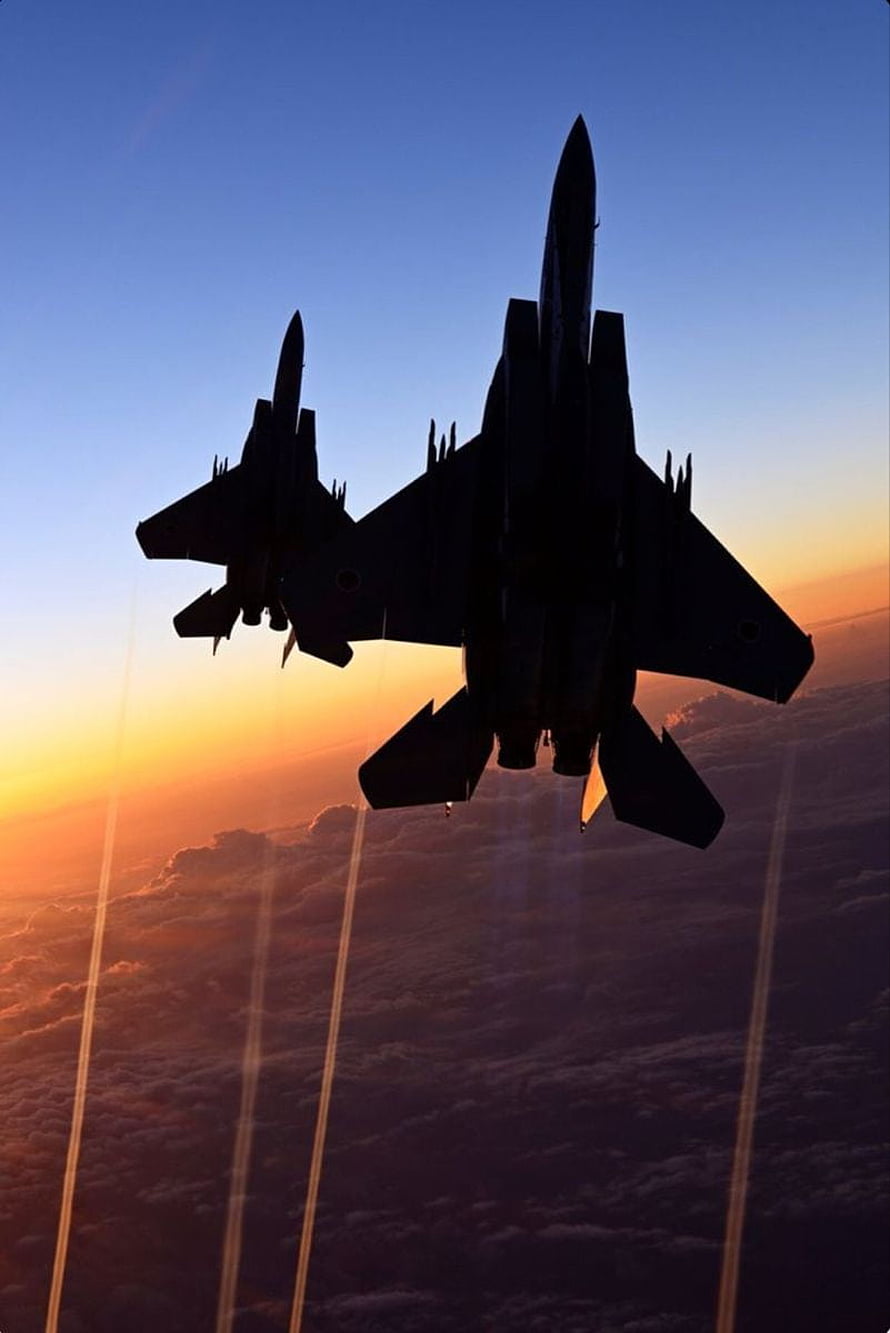 Silhouetted Fighter Jets Flying in Formation at Sunset Over Clouds HD phone wallpaper