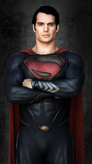 Henry Cavill as Superman in Man of Steel with arms crossed against a dark textured background, Man of Steel (2013) . Moviemania. Superman henry cavill, Supergirl superman, Superman cavill, Henry Cavill Superman HD phone wallpaper