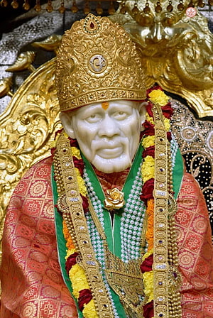 Sai Baba Murti Adorned in Golden Crown and Traditional Silk Garments HD phone wallpaper