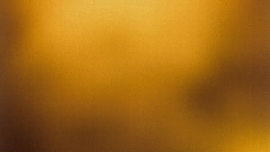 Elegant Gold Gradient Texture With Soft Blurred Light and Warm Amber Tones HD wallpaper