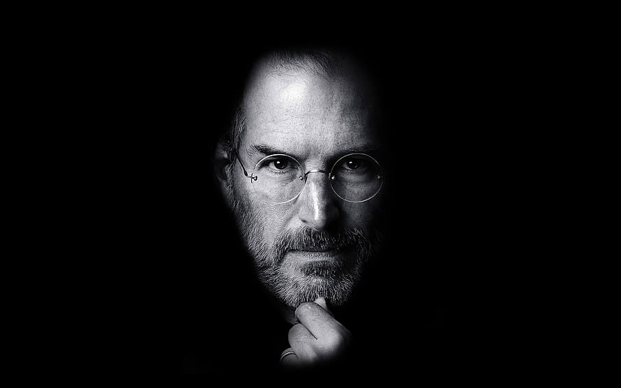 Steve Jobs Black and White Portrait with Round Glasses and Contemplative Expression HD wallpaper