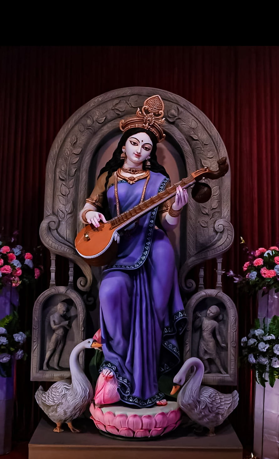 Goddess Saraswati Statue Playing Veena on Lotus Throne with Swans HD phone wallpaper
