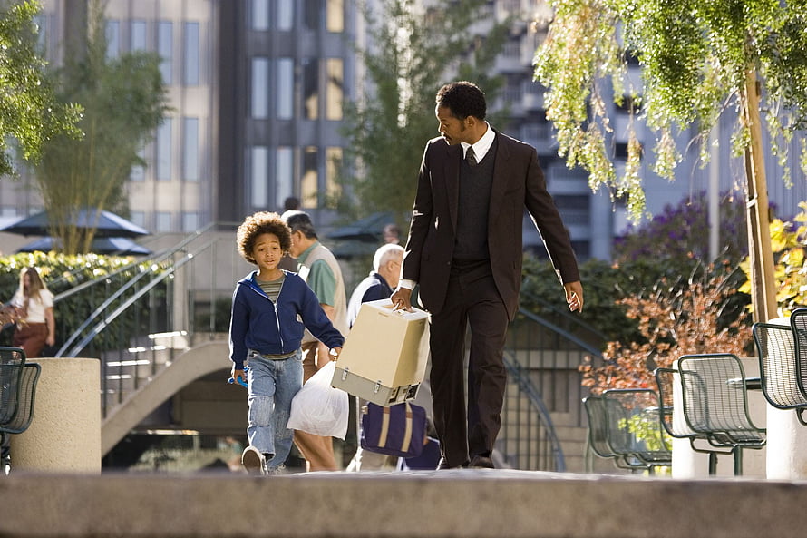 The Pursuit of Happyness Movie Scene with Man and Boy Carrying Box in City Park HD wallpaper