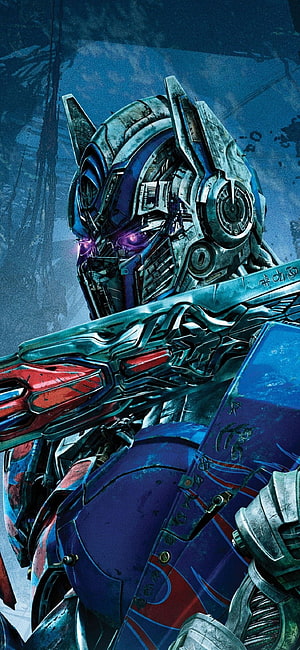 Optimus Prime Close-Up Portrait with Glowing Purple Eyes and Weathered Blue Armor HD phone wallpaper