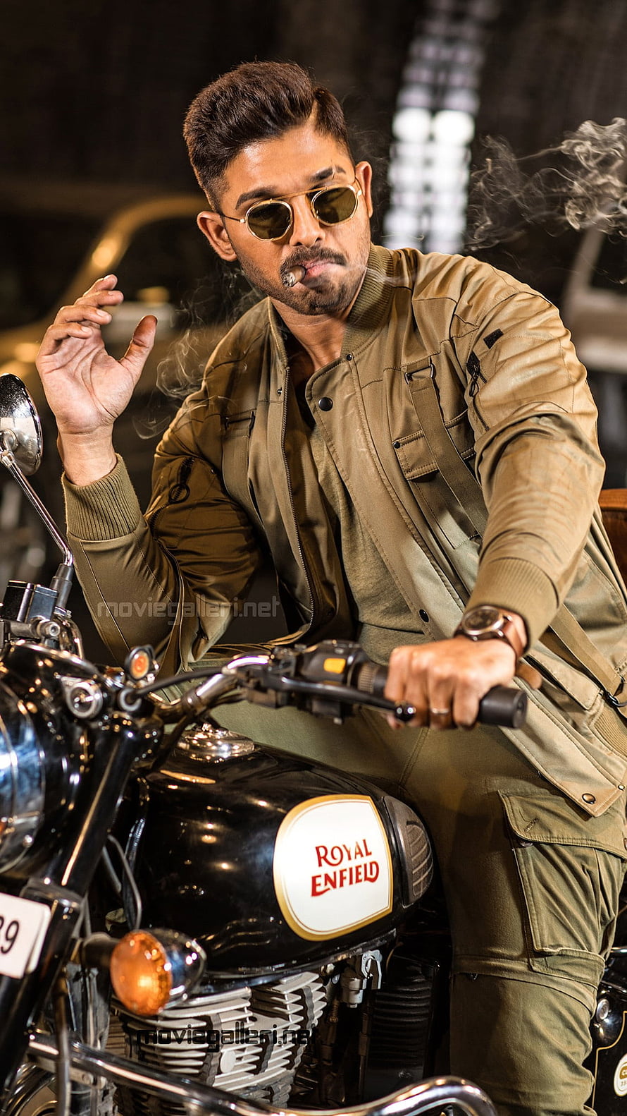 Allu Arjun in Naa Peru Surya on a Royal Enfield motorcycle with aviator sunglasses HD phone wallpaper
