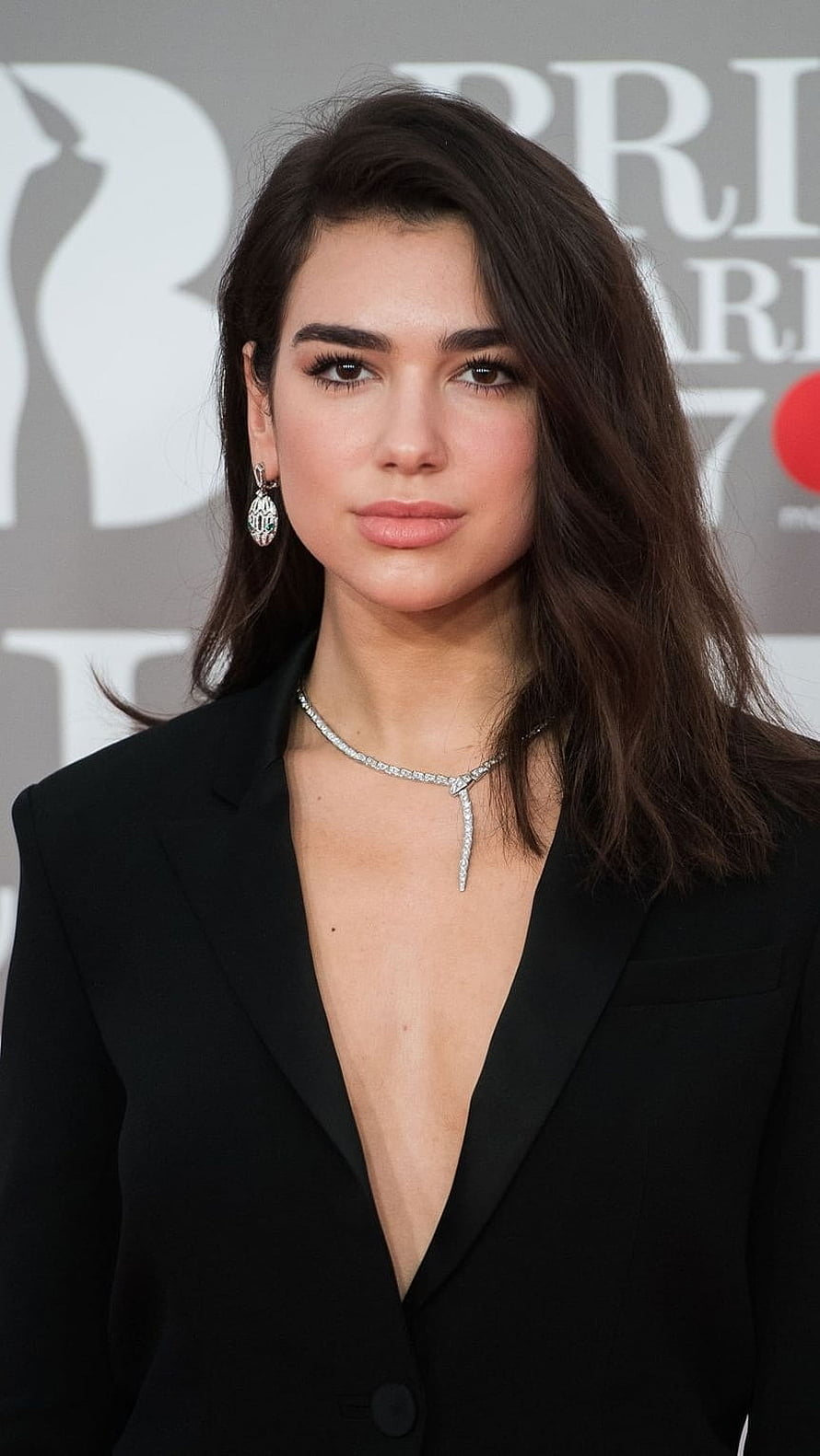 Dua Lipa in Black Blazer with Diamond Jewelry at BAFTA Awards HD phone wallpaper