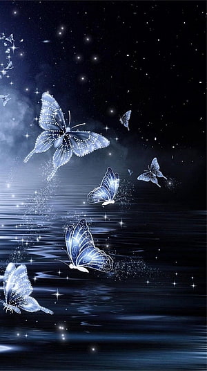 Luminous Blue Butterflies Dancing Over a Starlit Night Ocean HD phone wallpaper