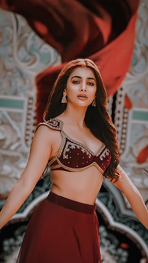 Pooja Hegde in ornate maroon costume with gold detailing and flowing red fabric HD phone wallpaper