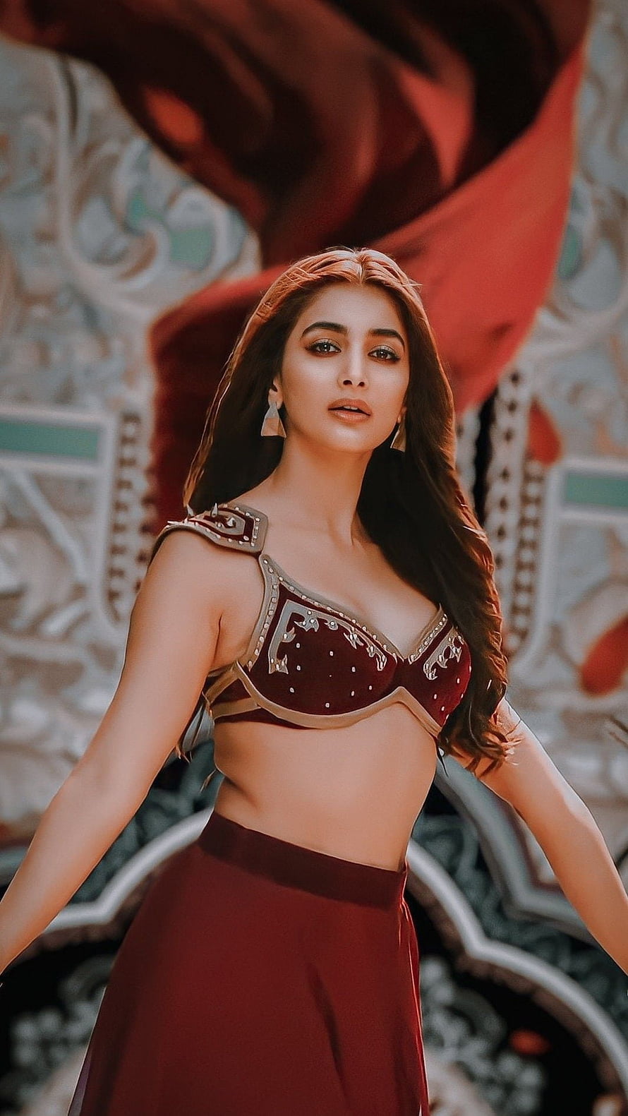Pooja Hegde in ornate maroon costume with gold detailing and flowing red fabric HD phone wallpaper