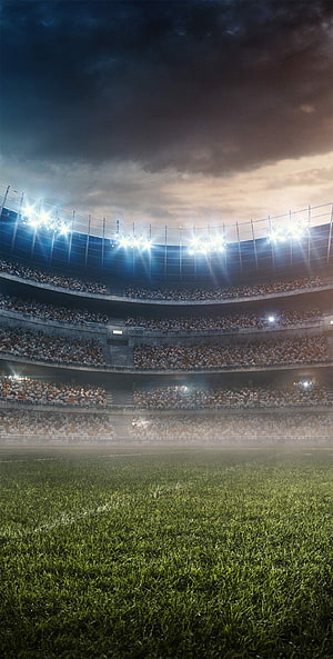 Dramatic Night Football Stadium with Floodlights and Crowded Stands HD phone wallpaper