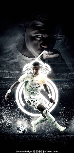 Vinicius Junior in Real Madrid Kit Striking a Ball with Glowing Club Crest HD phone wallpaper
