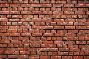 Rustic Red Brick Wall Texture with Weathered Surface and Mortar Lines HD wallpaper