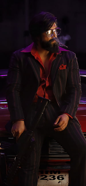 Yash as Rocky in KGF Chapter 2, Pinstripe Suit, Sunglasses, and Cigar in a Dark Cinematic Scene HD phone wallpaper