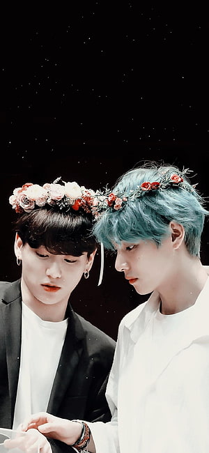 V and Jungkook from BTS wearing floral crowns in a romantic portrait HD phone wallpaper