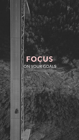 Aerial View of Highway Through Forest with Motivational Focus Quote Overlay HD phone wallpaper