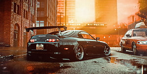 Black Toyota Supra MK4 with Large Rear Wing on Wet City Street at Sunset HD wallpaper