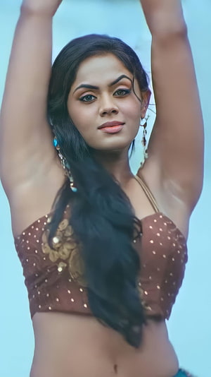 Karthika Nair in Traditional Brown Blouse with Gold Embroidery and Turquoise Earrings HD phone wallpaper