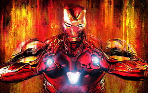 Iron Man Armor Portrait with Glowing Arc Reactor and Hand Repulsors in Fiery Red and Gold Tones HD wallpaper