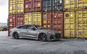 Audi RS7 Sportback in Nardo Gray Parked Before Stacked Shipping Containers HD wallpaper