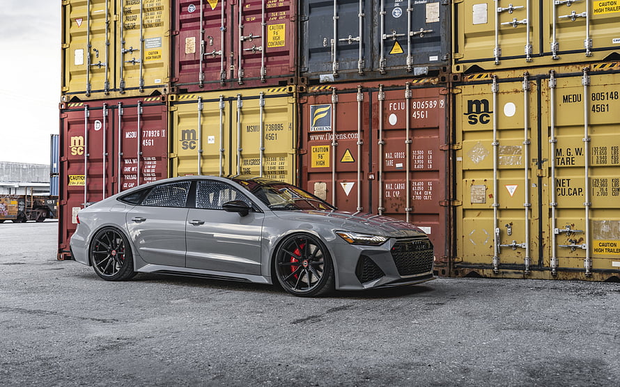 Audi RS7 Sportback in Nardo Gray Parked Before Stacked Shipping Containers HD wallpaper