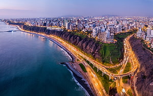 Aerial View of Miraflores District and Coastal Highway in Lima, Peru at Dusk HD wallpaper