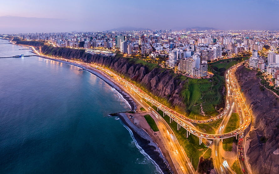 Aerial View of Miraflores District and Coastal Highway in Lima, Peru at Dusk HD wallpaper