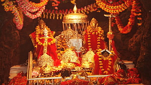 Mata Rani Vaishno Devi Temple Shrine with Golden Ornaments and Marigold Garlands HD wallpaper