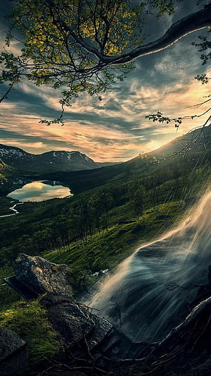 Misty Mountain Waterfall and Lake at Golden Hour with Overhanging Branches HD phone wallpaper