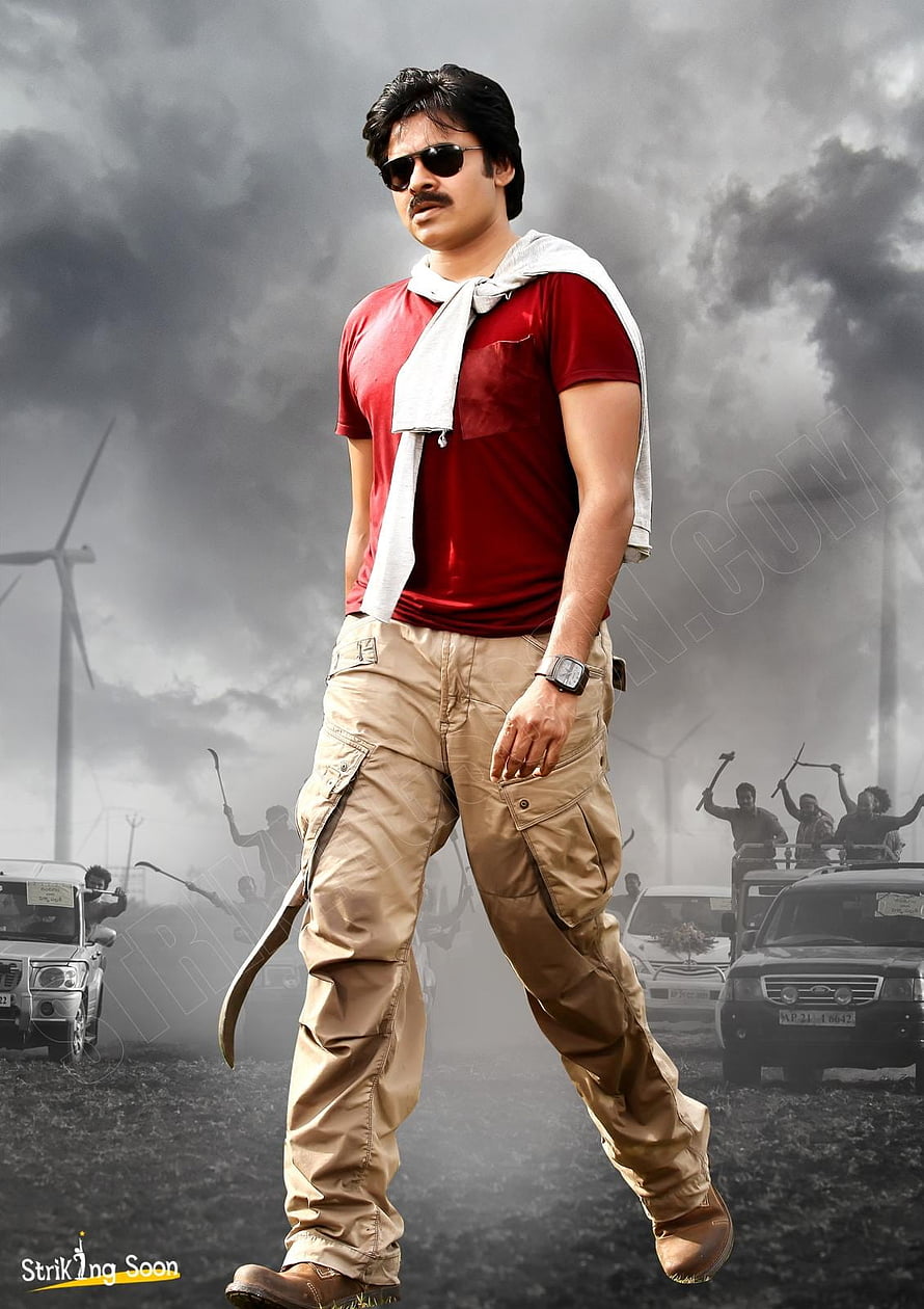 Pawan Kalyan in red shirt and khaki cargo pants with dramatic stormy background HD phone wallpaper