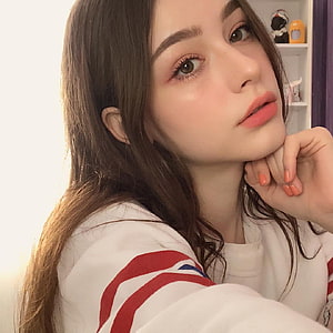 Dasha Taran Close-Up Portrait in White Sweatshirt with Red Stripes HD phone wallpaper