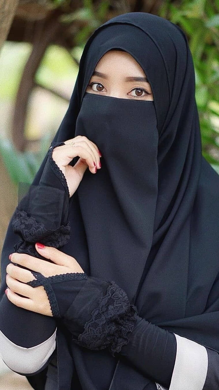 Elegant Muslim Woman in Black Niqab and Hijab with Lace Details HD phone wallpaper