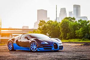 Black and Blue Bugatti Veyron Grand Sport Vitesse Parked on Gravel at Sunset HD wallpaper