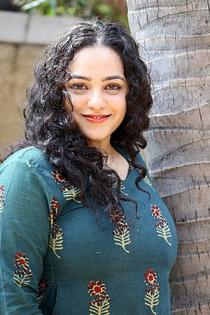 Nithya Menon Portrait in Green Embroidered Kurta with Curly Hair HD phone wallpaper