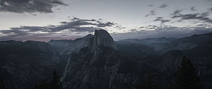 Half Dome at Dusk in Yosemite National Park with Dramatic Clouds and Mountain Ranges HD wallpaper