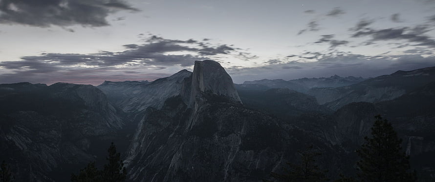 Half Dome at Dusk in Yosemite National Park with Dramatic Clouds and Mountain Ranges HD wallpaper