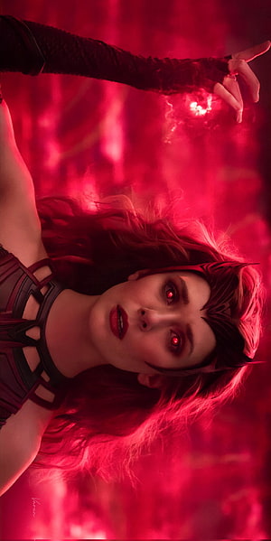 Elizabeth Olsen as Wanda Maximoff with glowing red eyes in a dramatic crimson-lit Marvel scene HD phone wallpaper