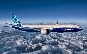 Boeing 777X Airliner Cruising Above Clouds in Blue Sky HD wallpaper