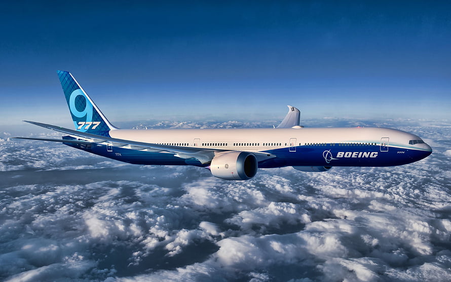 Boeing 777X Airliner Cruising Above Clouds in Blue Sky HD wallpaper